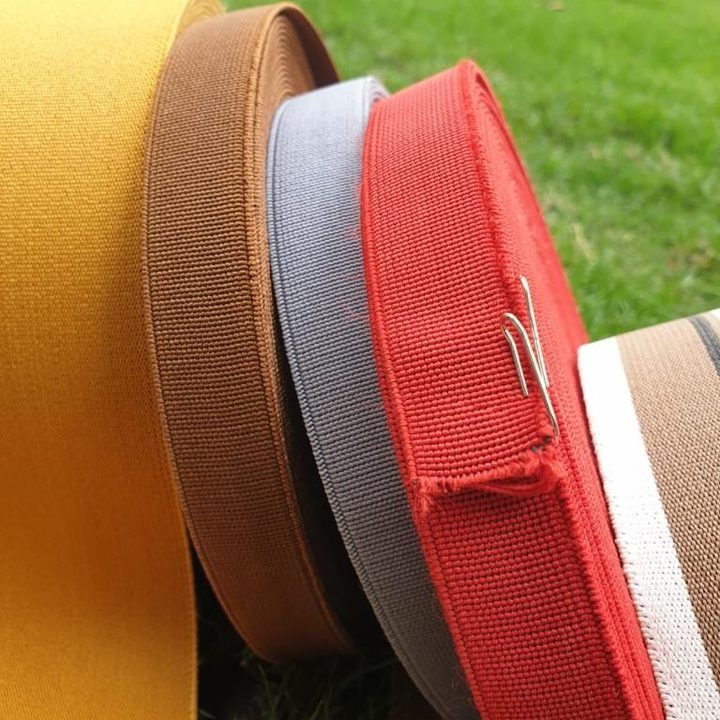 Mustard, brown, grey and red loom elastic rolls by Lion Grip, Lahore